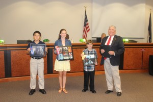 2015 Freeze Frame Photography Winners are recognized at the Berkeley County Council meeting held August 24, 2015. Pictured from left to right: EJ Feres, Katherine Dixon, Kenneth Fischer, and County Supervisor William Peagler.